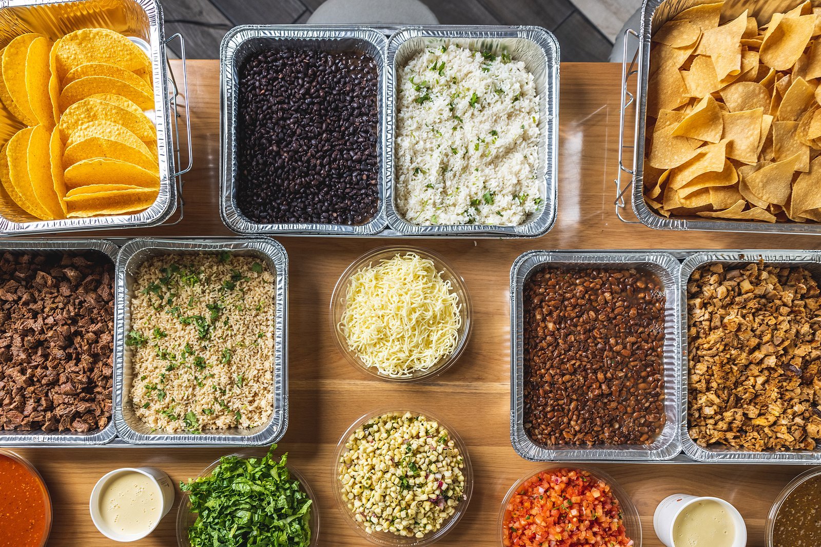 DosBros catering build-your-own taco, nacho, burrito and bowl spread